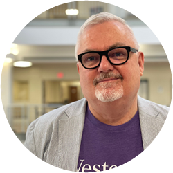 A professional headshot of David.