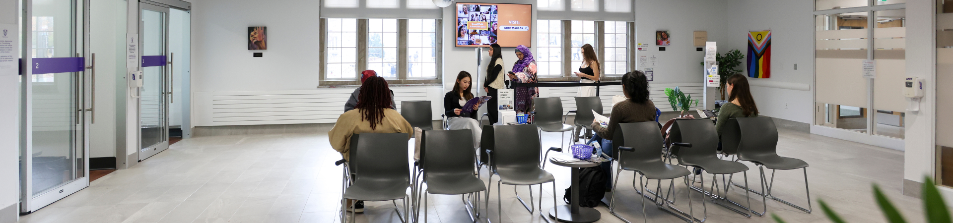 Several students waiting in a waiting room.