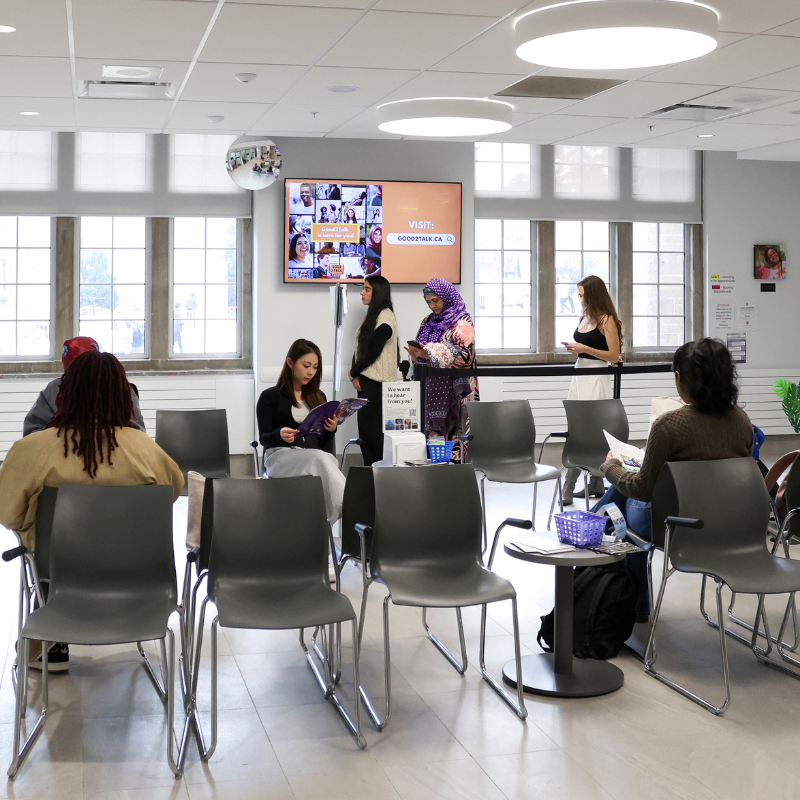 Several students waiting in a waiting room.