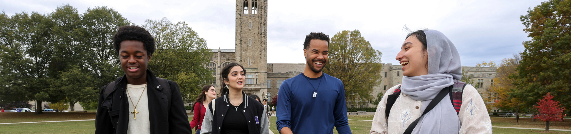 Several students walk around outside.