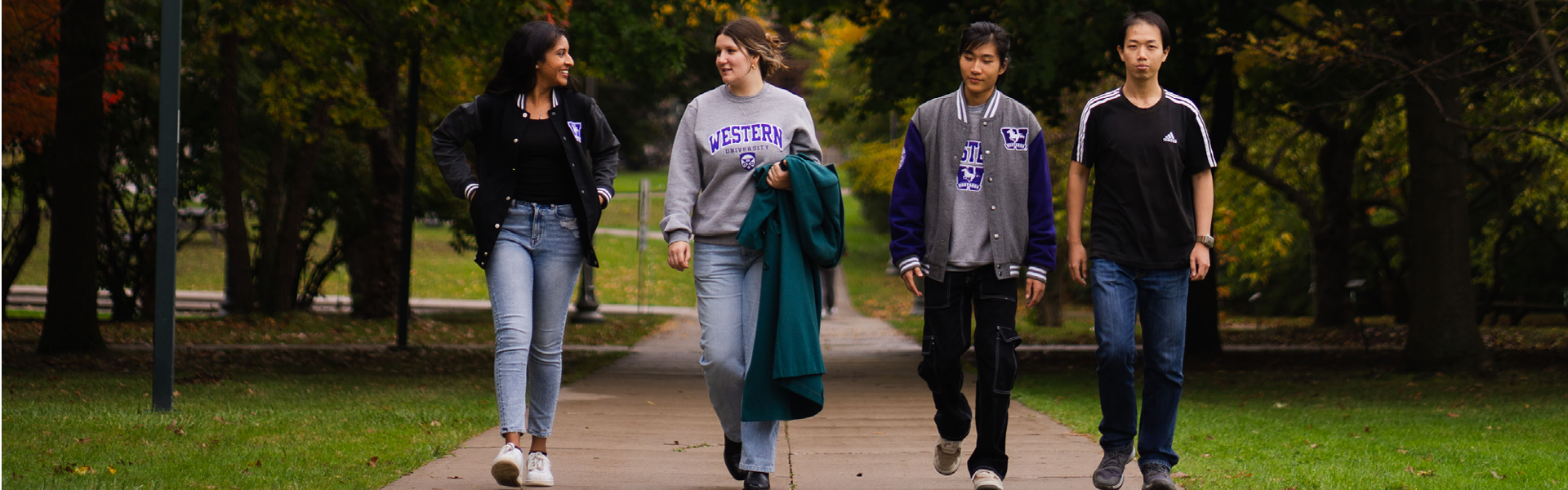 4 Western students walk on campus